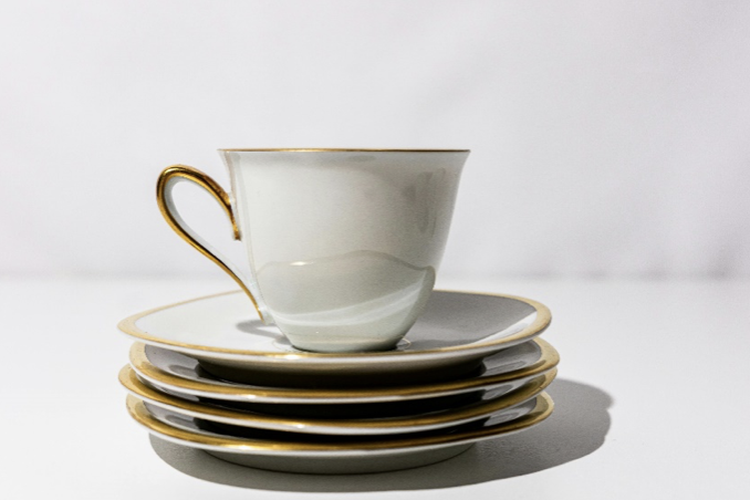 Teacup and stacked saucers on a desk