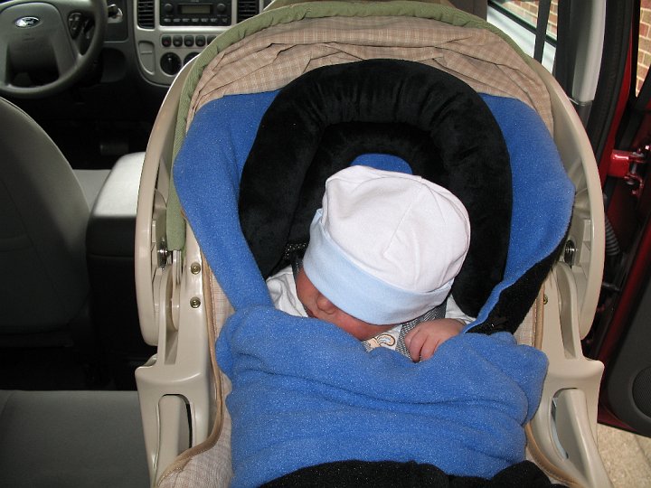 IMG_0893.JPG - The ride home made Alexander very tired.  The hat over the eyes did not help.