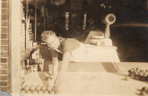 Eddie Gabuzda working at his father's grocery store